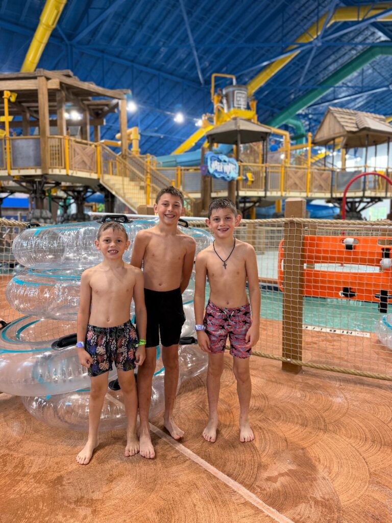Children enjoying slides and splash features at a kid-focused indoor water park