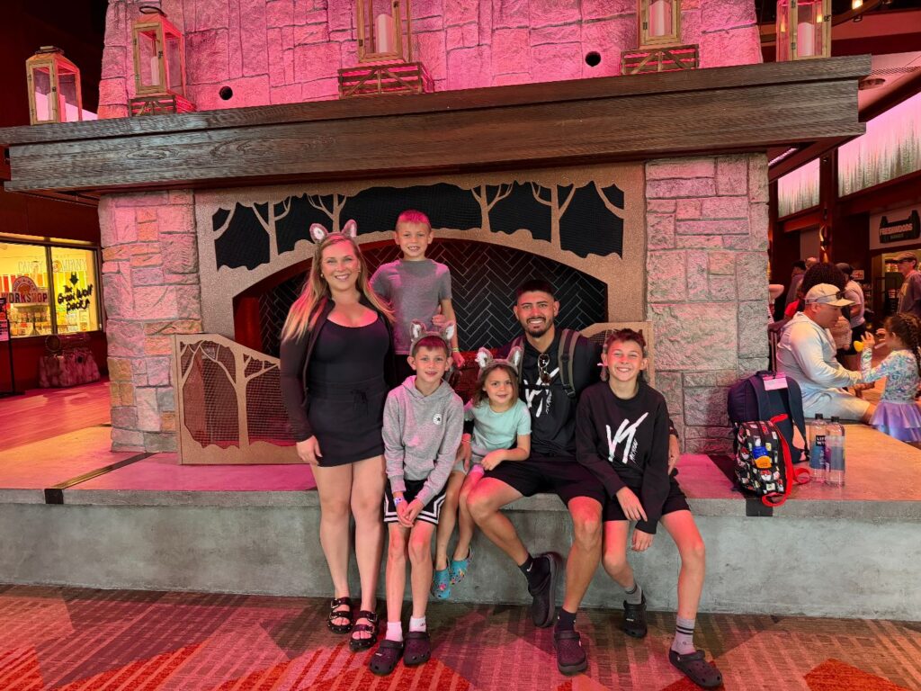 Mom traveling with four kids at an all-in-one family resort